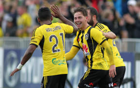 Phoenix's Jason Hicks celebrates his equalizer with Roy Krishna.