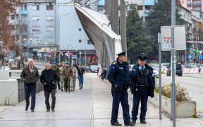 MITROVICA, KOSOVO - DECEMBER 06: A general view of the scene as security forces take measures nearby the Municipal Elections Commission office on the northern bank of the Ibar river of Mitrovica, the northern city of Kosovo, following five explosions, multiple rifle gunshots, and air raid sirens on Tuesday, Dec 6, 2022. Vudi Xhymshiti / Anadolu Agency (Photo by Vudi Xhymshiti / ANADOLU AGENCY / Anadolu Agency via AFP)
