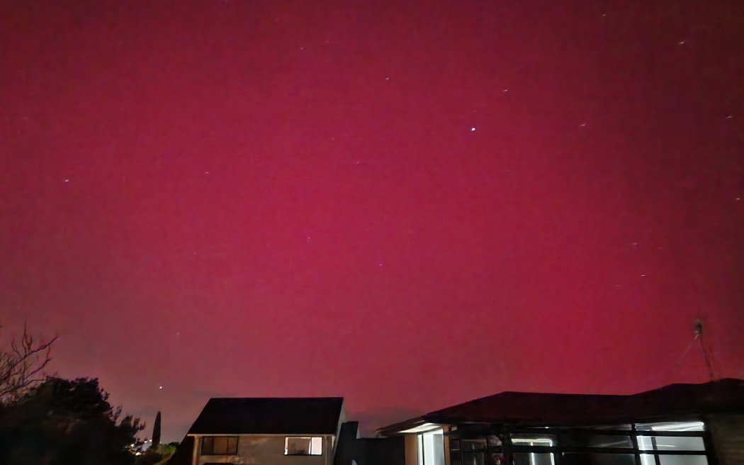 The sky lit up pink in Glendene, west Auckland on 11 May, 2024.
