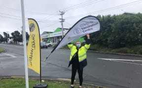 'Hype girl' in action at the Panmure vaccination centre today.