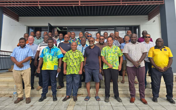 Vanuatu PM Jotham Napat, standing third from left in front, with his government MPs in Port Vila. 18 December 2025
