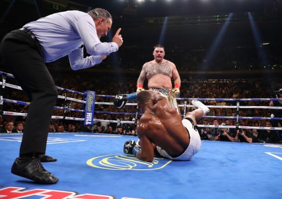 Andy Ruiz Jr knocks down Anthony Joshua in the third round during their IBF/WBA/WBO heavyweight title fight at Madison Square Garden.
