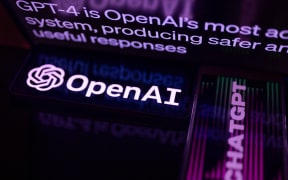 OpenAI is displayed on a smartphone with ChatGPT 4 seen in the background, in this photo illustration, in Brussels, Belgium, on 20 September, 2023.