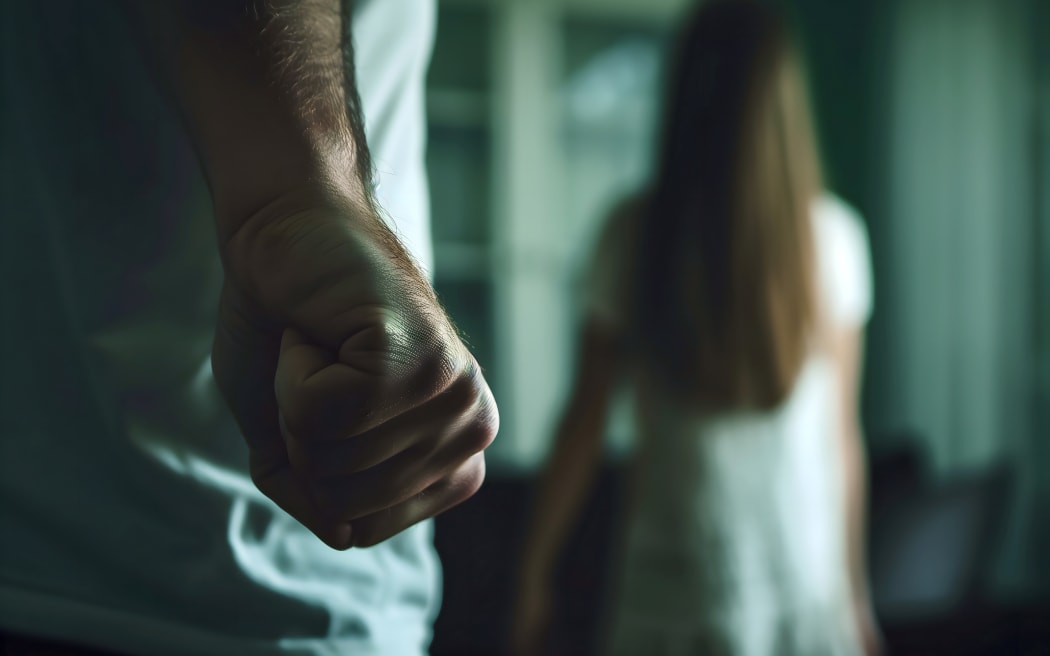 Man holding in front of a woman, view from the back, girl in the background, theme of domestic violence. Neural network generated image. Not based on any actual scene or pattern.