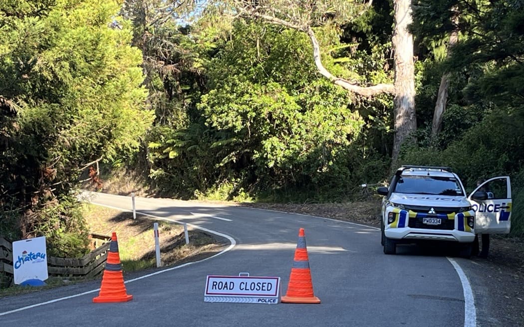 A police cordon including a police vehicle block The 309 Road south of Coromandel Town on the Coromandel Peninsula.