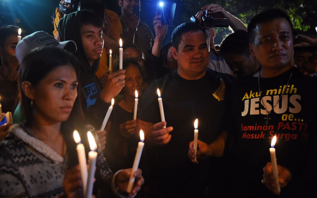 Supporters from the same church group as Andrew Chan held a vigil at the port opposite Nusakambagan prison island.