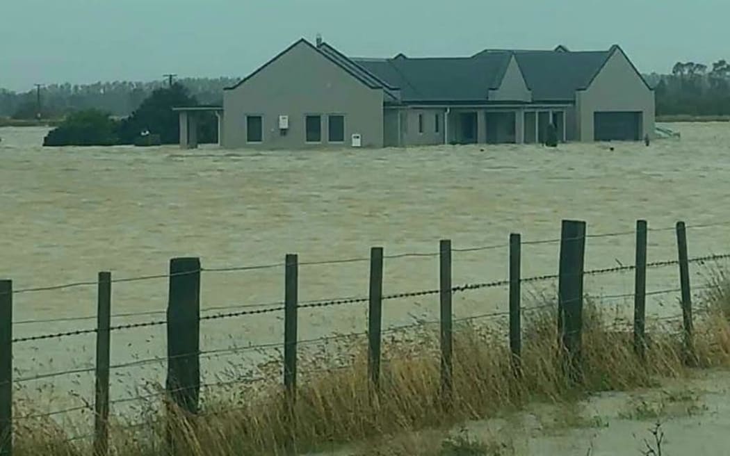 Evacuated house and flooded road in Pirinoa - South Wairarapa.