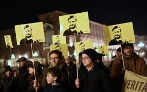 In this file photo taken on January 25, 2020 Activists of human rights organization Amnesty International (AI) take part in a demonstration in Piazza Castello in Turin, to mark the fourth anniversary since the disappearance of Italian student Giulio Regeni.