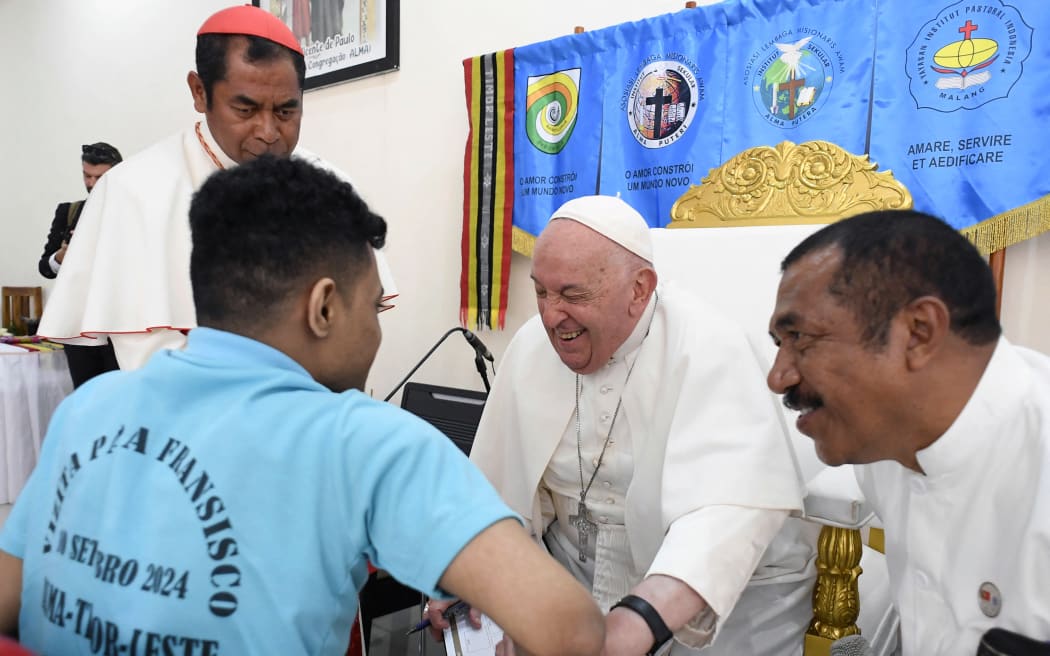 Pope Francis visits a school for children with disabilities in Dili, Timor Leste, East Timor, 2024/9/10. The Irmas Alma school commemorates its 60th anniversary. Timor Leste is the third stop of a marathon 12-day tour to the Asia-Pacific region. Photograph by VATICAN MEDIA / CPP / HANS LUCAS.
Le pape Francois visite une ecole pour enfants handicapes a Dili, Timor Leste, Timor oriental, 2024/9/10. L ecole Irmas Alma commemore son 60e anniversaire. Timor Leste est la troisieme etape d une tournee marathon de 12 jours dans la region Asie Pacifique. Photographie de VATICAN MEDIA / CPP / HANS LUCAS. (Photo by Vatican Media / CPP / HANS LUCAS / Hans Lucas via AFP)