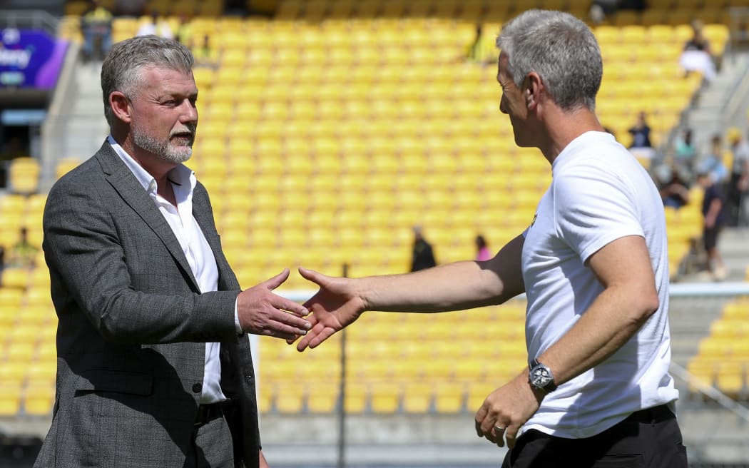 Former Wellington Phoenix coach Ufuk Talay of Sydney FC greets interim coach Chris Greenacre of the Phoenix greet each other during the round 19 A-League Men match between Wellington Phoenix and Sydney FC.