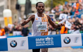 Kenenisa Bekele crosses the finish line in Berlin.