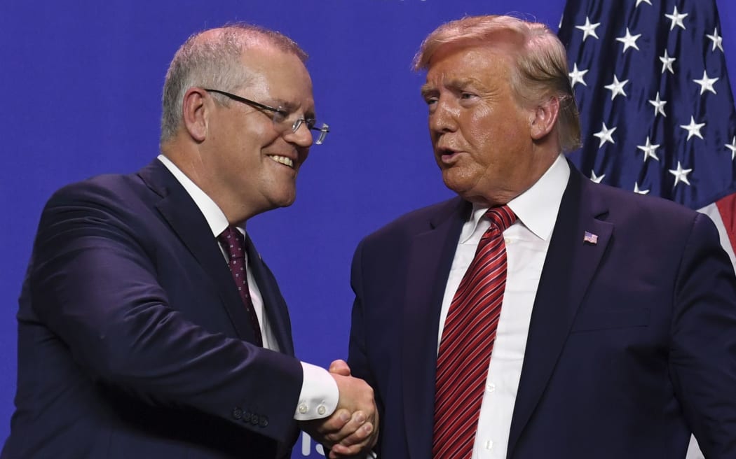 US President Donald Trump and Australian Prime Minister Scott Morrison shake hands.