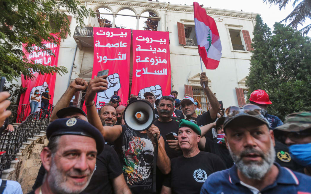 Lebanese protesters gather in the courtyard of the Ministry of Foreign Affairs in Beirut on August 8, 2020, after they stormed the headquarters