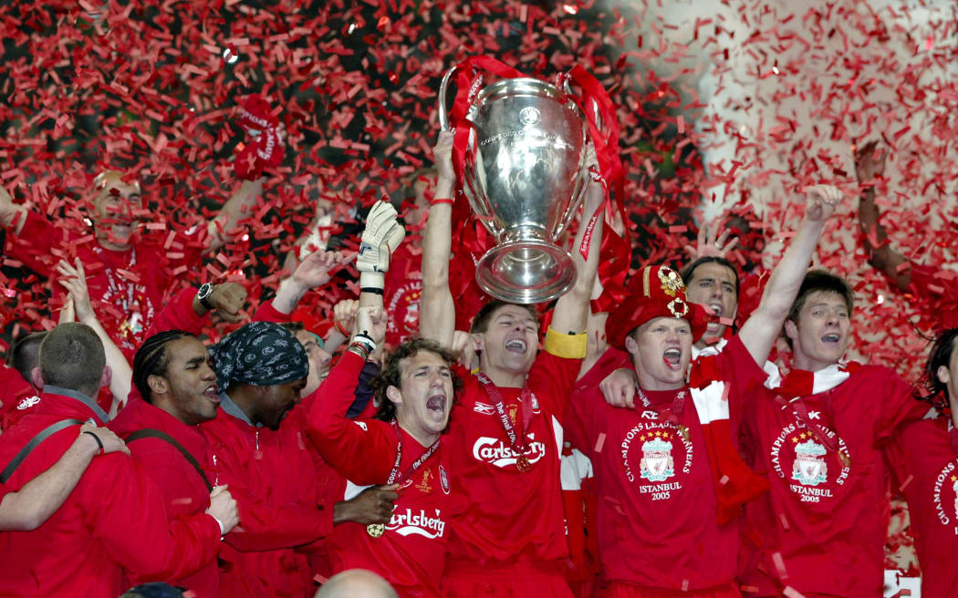 Liverpool captain Steven Gerrard lifts the trophy surrounded by celebrating team-mates after their 2005 UEFA Champions League Final victory over AC Milan.