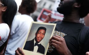 People protesting to mark the five year anniversary of Eric Garner's death.