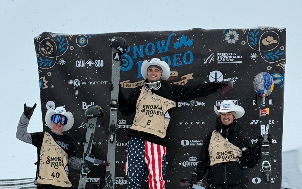 New Zealand free skier Finley Melville Ives, left, on the podium after finishing second to American Nick Goepper, centre, and Birk Irving, who was third in the FIS World Cup halfpipe event in Calgary, 4 January, 2026. (Photo from Snow Sport NZ).