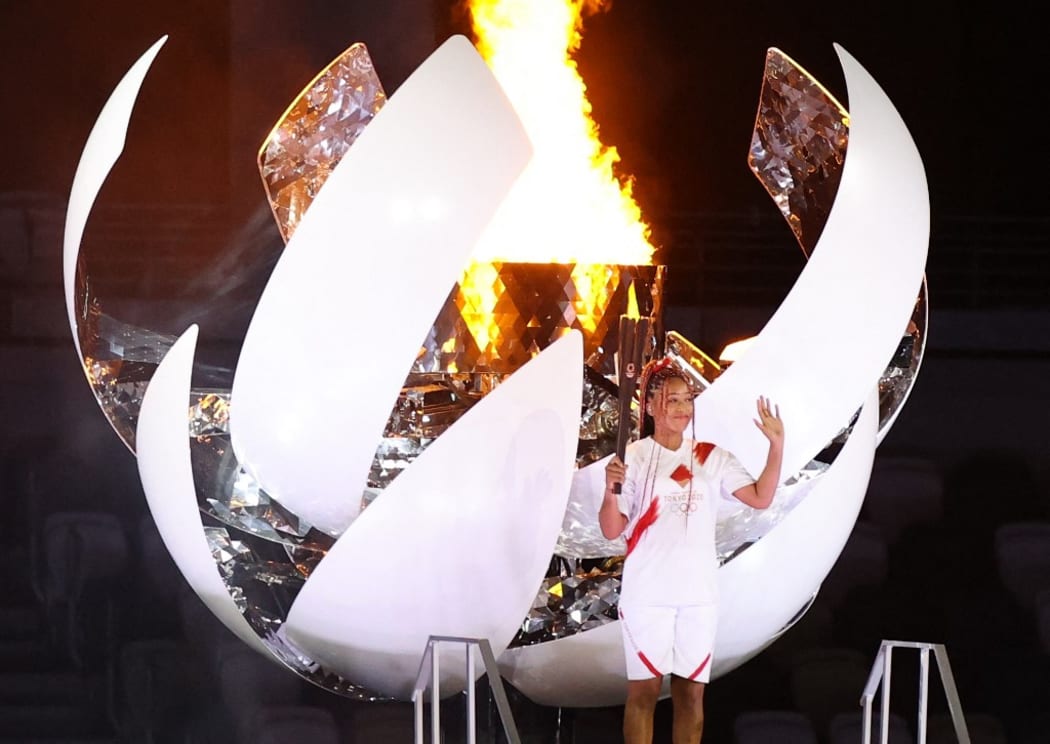 Naomi Osaka, Japanese tennis player, ignites the torch during the Opening Ceremony of the Tokyo 2020 Olympic Games at National Stadium in Tokyo on July 23rd, 2021.