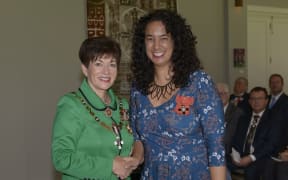 Her Excellency The Rt Hon Dame Patsy Reddy presents Ms Petrina Togi-Sa’ena her MNZM for services to Pacific music.