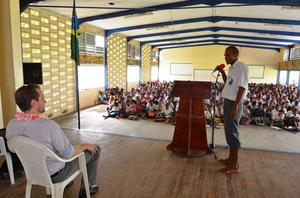 A student of KGVI asks a question to the RAMSI Special Coordinator, Quinton Devlin during the drawdown briefing at the school.