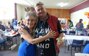 Gabrielle Carman with community dinner regular Ken Ranford.