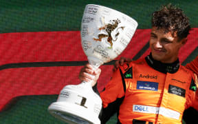 Winner McLaren's British driver Lando Norris celebrates during the podium ceremony after the Formula One Dutch Grand Prix at The Circuit Zandvoort, Netherlands, 2024.