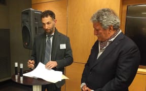 Minister Jean-Christophe Bouissou (right) with Randolph Hencken (left) of the Seasteading Institute at the signing of the memorandum of understanding of the floating island project.