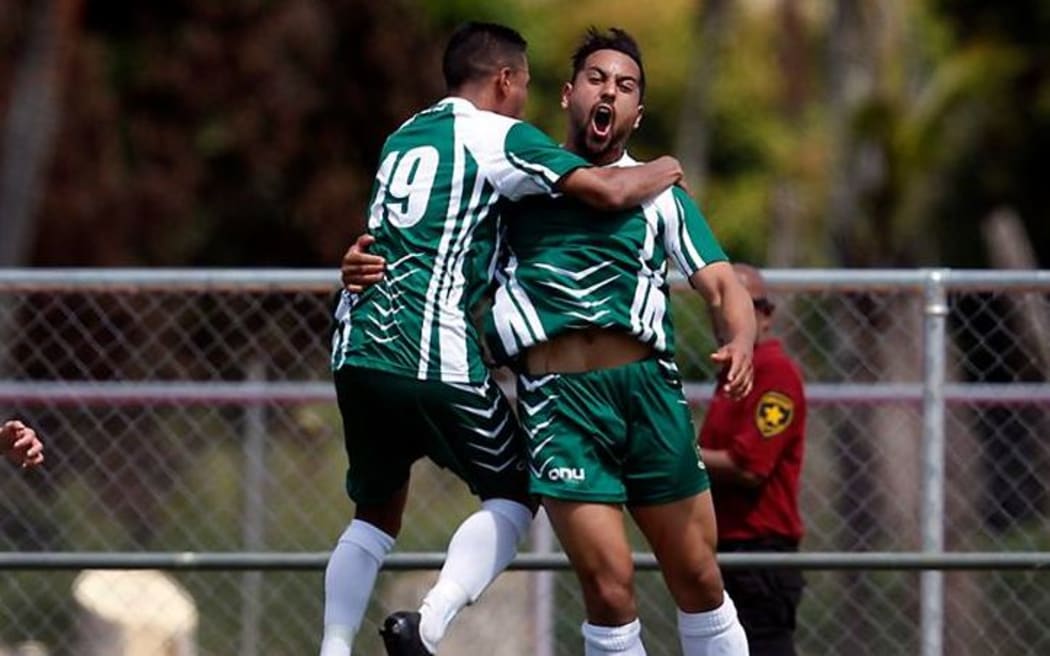 Cook Islands striker Taylor Saghabi celebrates a goal.