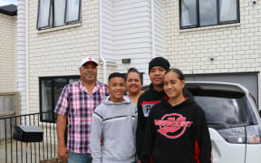 Sateki Vehikite (left), his wife Mele Vehikite (centre) and their children.
