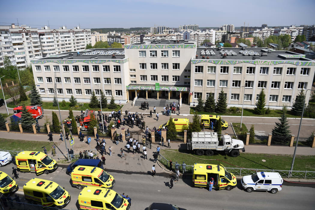 Police and paramedics work at the scene of a shooting at Gymnasium No. 175 in Kazan.