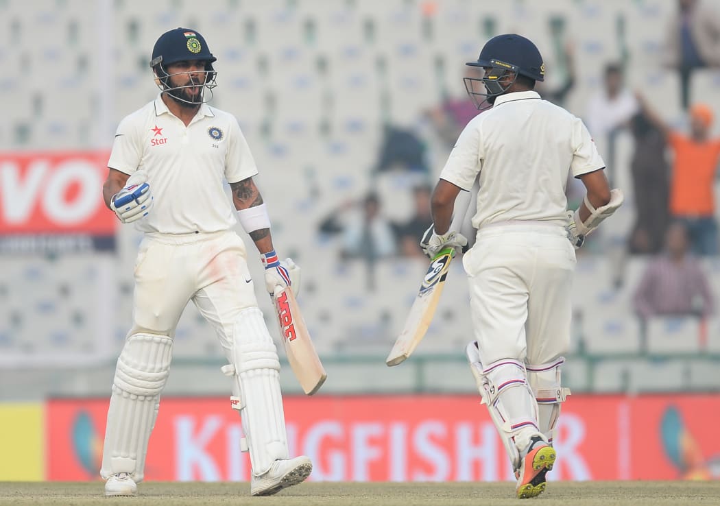 Virat Kohli (L) and Parthiv Patel (R) steer India to a Test win over England.