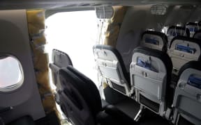 PORTLAND, OREGON - JANUARY 7: In this National Transportation Safety Board (NTSB) handout, an opening is seen in the fuselage of Alaska Airlines Flight 1282 Boeing 737-9 MAX on January 7, 2024 in Portland, Oregon. A door-sized section near the rear of the Boeing 737-9 MAX plane blew off 10 minutes after Alaska Airlines Flight 1282 took off from Portland, Oregon on January 5 on its way to Ontario, California.   NTSB via Getty Images/AFP (Photo by Handout / GETTY IMAGES NORTH AMERICA / Getty Images via AFP)