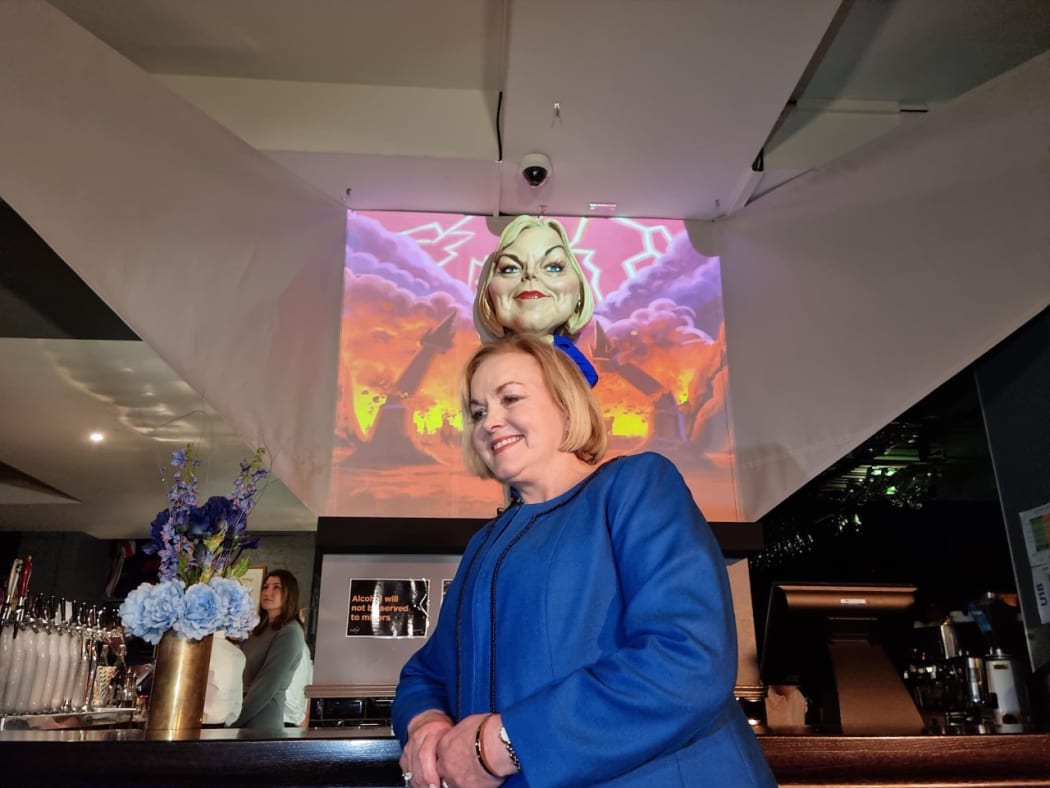 National leader Judith Collins with puppet caricature at Wellington's Backbencher pub.
