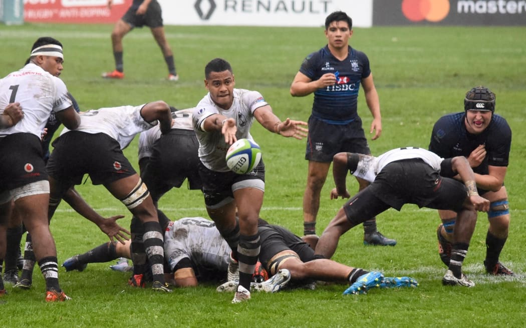 Fiji feeds the ball to the backs in their first up win over Hong Kong at the Junior World Trophy.