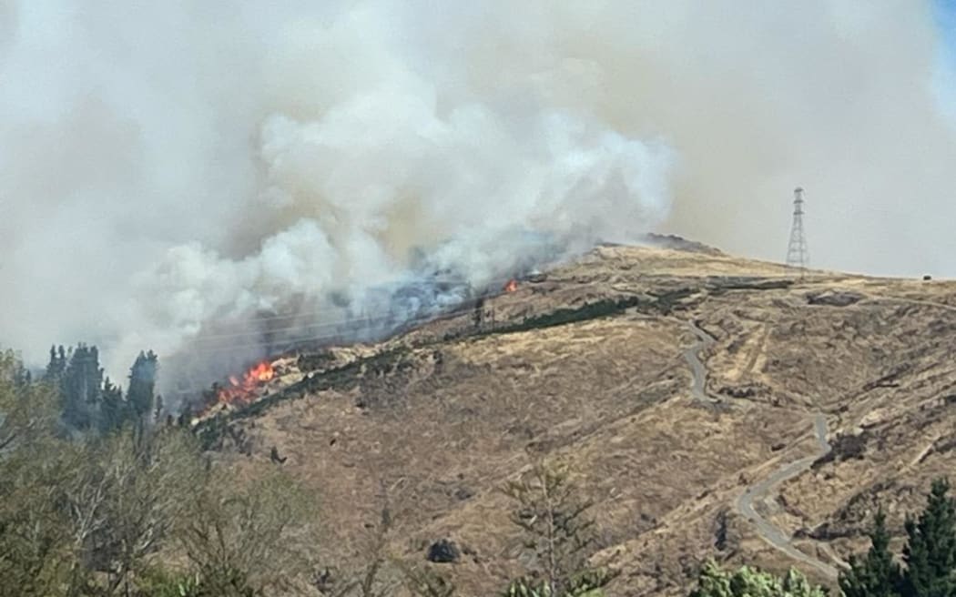 Firefighters continue to battle fire in the Port Hills near Christchurch on 15 February, 2024, after it broke out the day before.