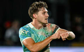 Warriors halfback Luke Metcalf gives the 'Dame Time' celebration after kicking the winning penalty against Brisbane.