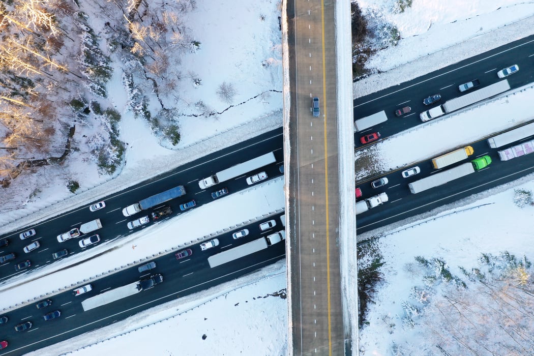 In an aerial view, traffic creeps along Virginia Highway 1 after being diverted away from I-95 after it was closed due to a winter storm on January 04, 2022