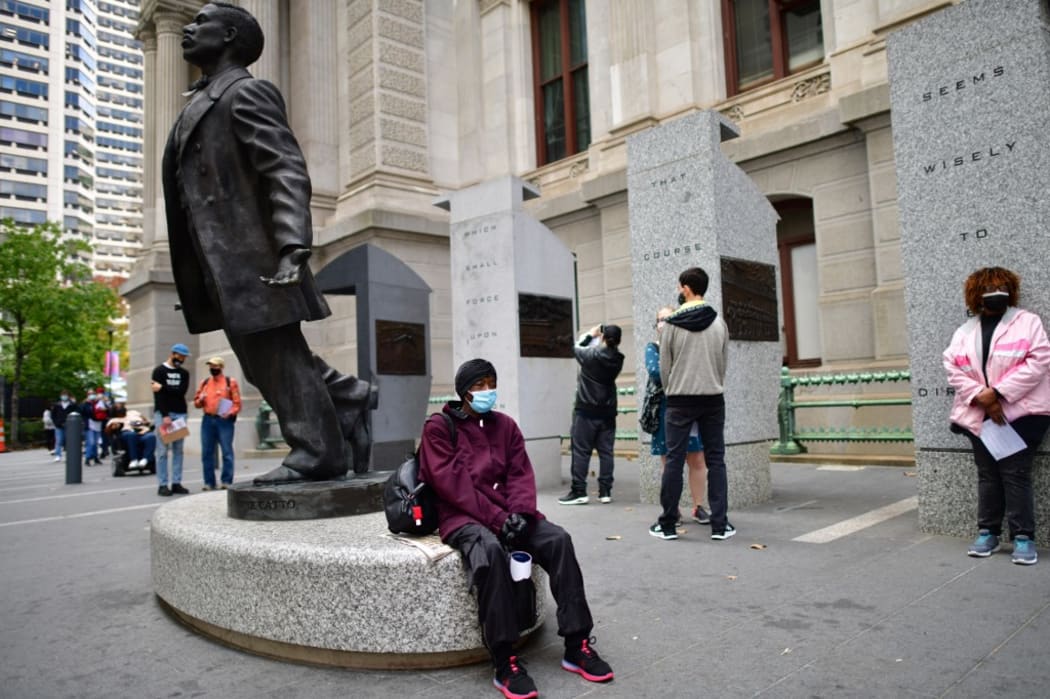 PHILADELPHIA, PA - OCTOBER 27: Voters queue outside of Philadelphia City Hall to cast their early voting ballots at the satellite polling station on October 27, 2020 in Philadelphia, Pennsylvania.