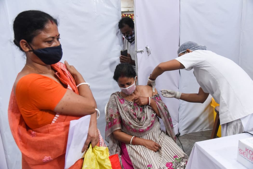 Women gets vaccine against COVID-19 coronavirus disease, at a vaccination centre in Guwahati, India on 05 May 2021.
