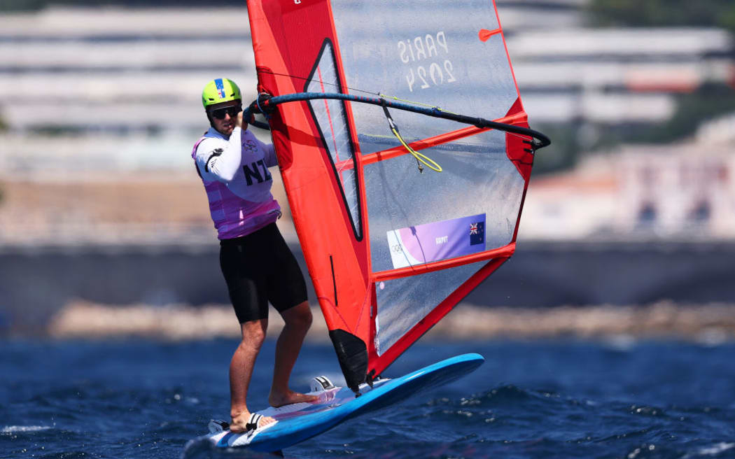 MARSEILLE, FRANCE - AUGUST 03: Josh Armit of Team New Zealand competes in the Men's Windsurf iQFoil class on day eight of the Olympic Games Paris 2024 at Marseille Marina on August 03, 2024 in Marseille, France. (Photo by Phil Walter/Getty Images)