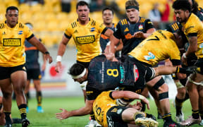Chiefs No.8 Luke Jacobson scores the match winner against the Hurricanes