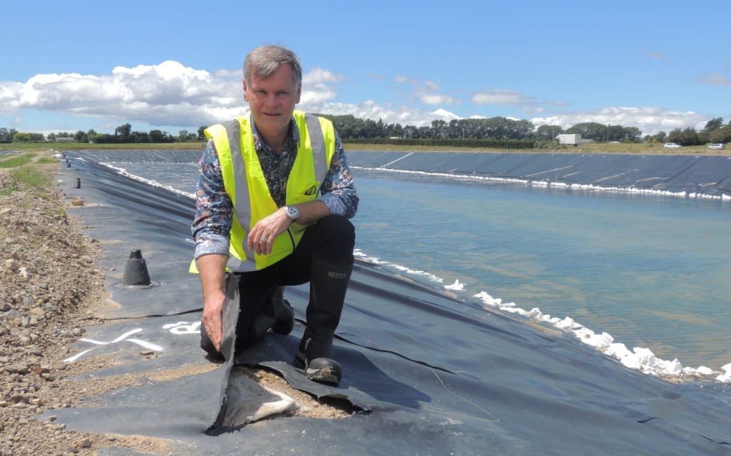 Carterton District Council chief executive Geoff Hamilton with some of the lining damage.