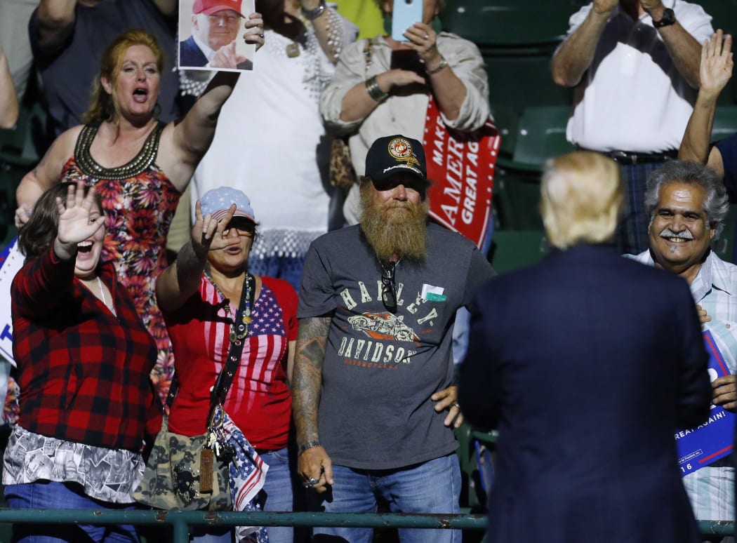 Supporters cheer for Republican Presidential nominee Donald Trump during a campaign rally at the Mississippi Coliseum.