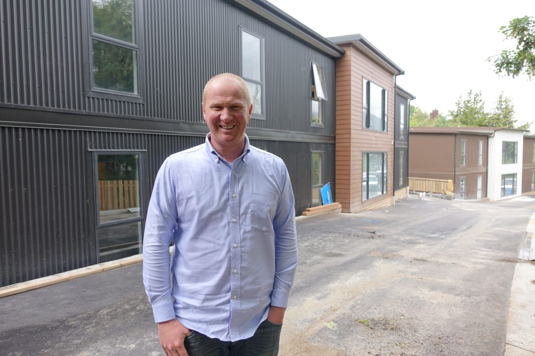 Bus driver and property developer Simon Haslett has helped charity workers move into new residence.