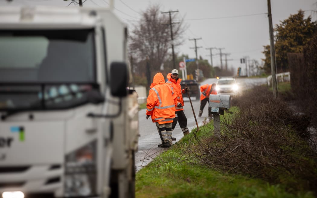 Roading contractors clearing debris ahead of the incoming weather event