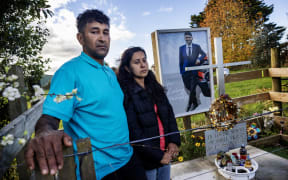 Rajesh and Ashima Prasad, parents of Sahil Prasad who was killed in a crash on State Highway 26 at Newstead on 21 July 2023. The property owner of the crash scene donated a small section of land to build a memorial for Prasad which his family and friends regularly visit.  New Zealand Herald photograph by Mike Scott