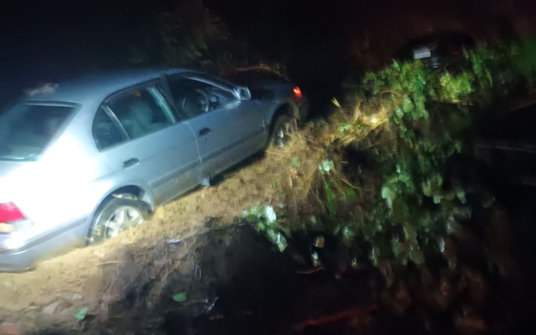 The car was buried up to its wheel rims.