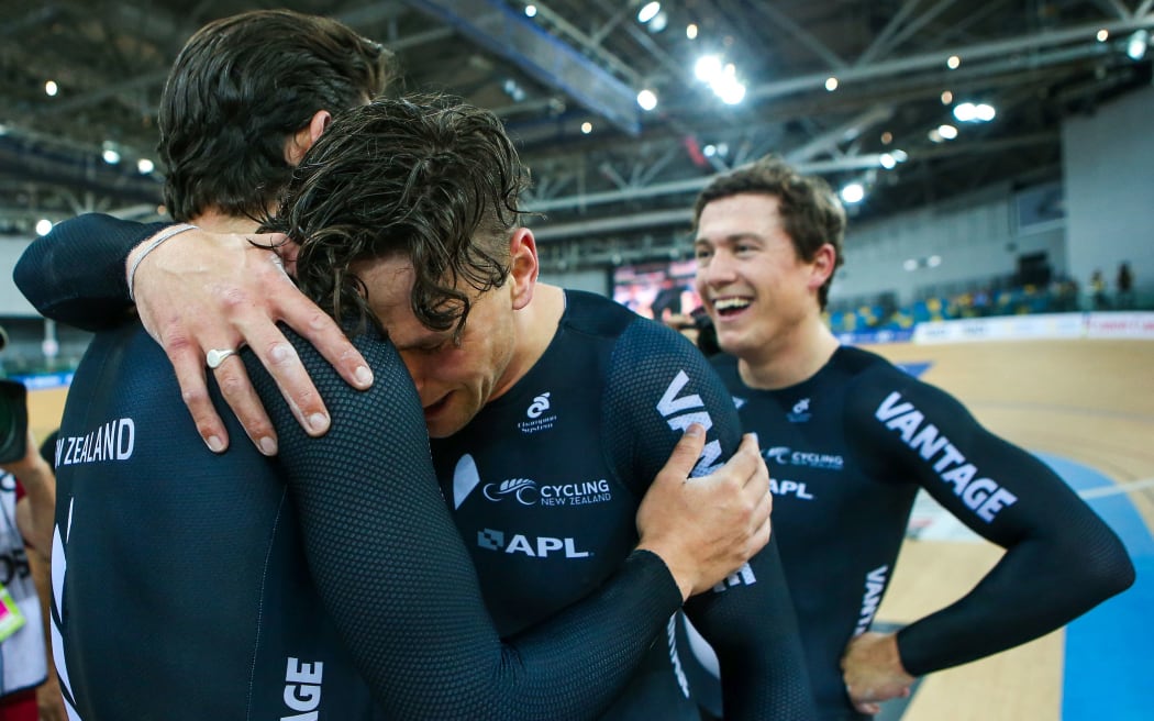 Eddie Dawkins, Ethan Mitchell and Sam Webster celebrate after winning 2017 World Championship team sprint title.