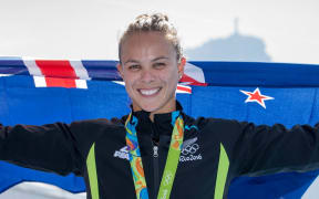New Zealand's Lisa Carrington wins gold in the womens k1 200m at Lagoa Stadium, Olympic rowing.