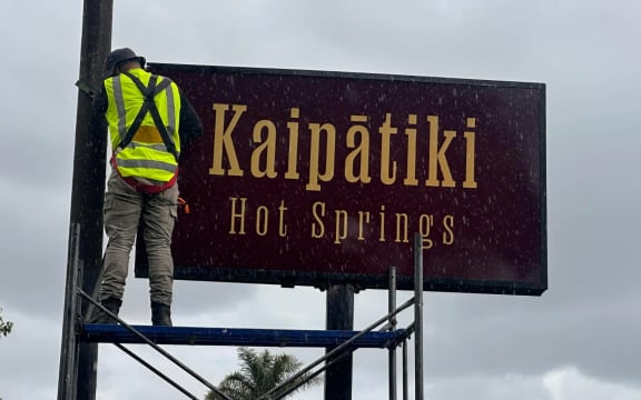 Close up of the new sign for Kaipātiki Hot Springs.