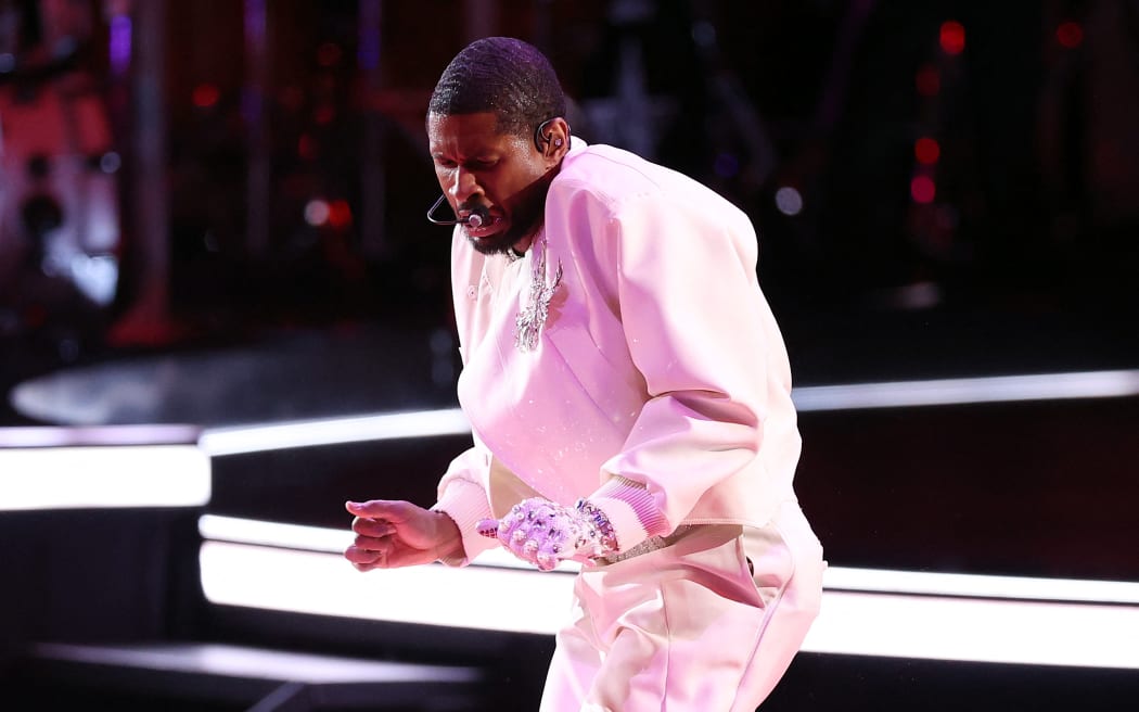 LAS VEGAS, NEVADA - FEBRUARY 11: Singer Usher performs on the field during the Apple Music Super Bowl LVIII Halftime Show at Allegiant Stadium on February 11, 2024 in Las Vegas, Nevada.   Steph Chambers/Getty Images/AFP (Photo by Steph Chambers / GETTY IMAGES NORTH AMERICA / Getty Images via AFP)